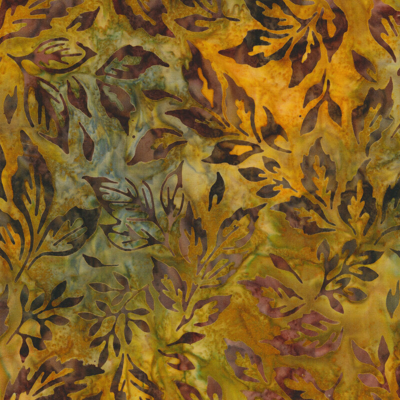 yellow and olive green mottled fabric featuring scattered leaves in shades of mottled maroon and brown