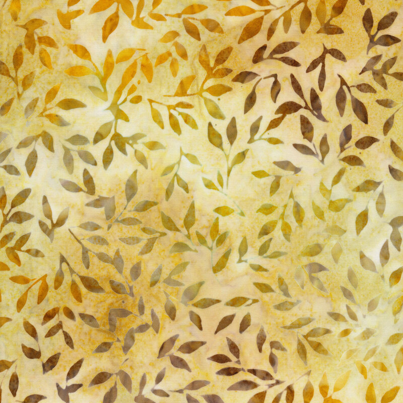 golden yellow mottled fabric featuring scattered leaves and vines in shades of mottled green, orange and brown
