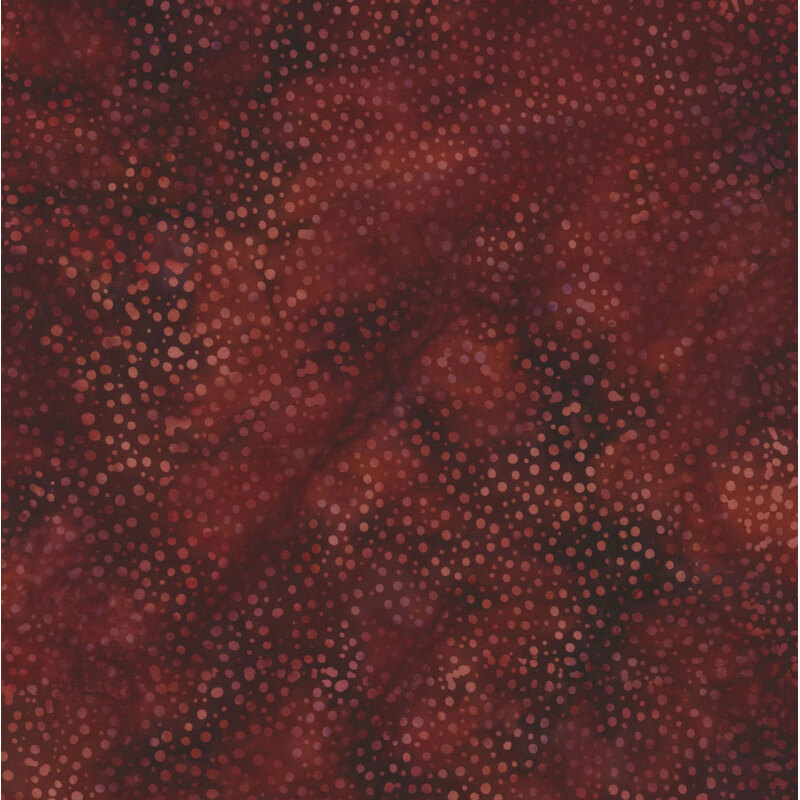 Dark fabric with lighter mottled dots all over and reddish mottling