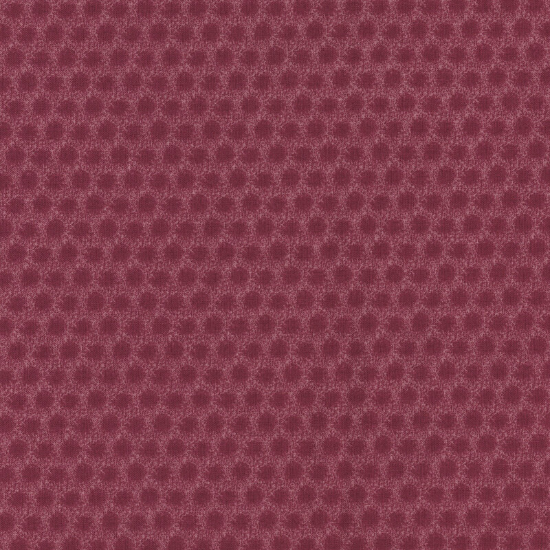 Tonal dark plum fabric with a dotted effect throughout