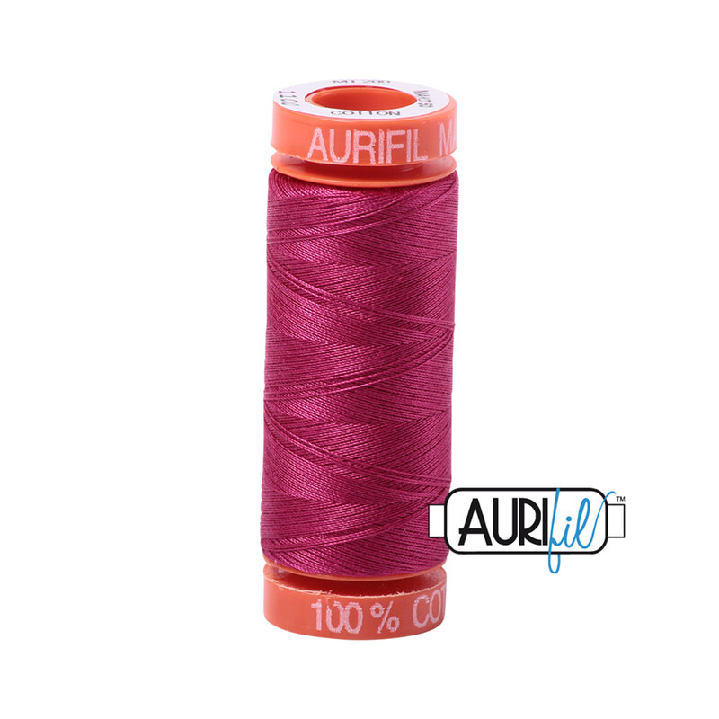 Red Plum thread on an orange spool, isolated on a white background