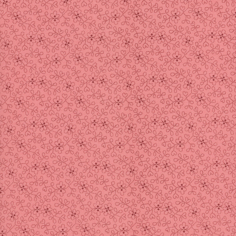 tonal pink fabric with a swirled floral design throughout