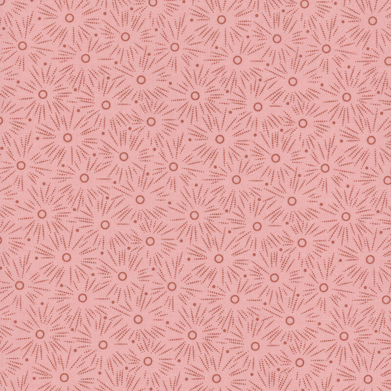 tonal pink fabric with a polka dotted starburst pattern throughout