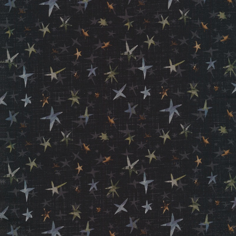 faded black textured fabric featuring scattered gray, blue, brown, and green stars