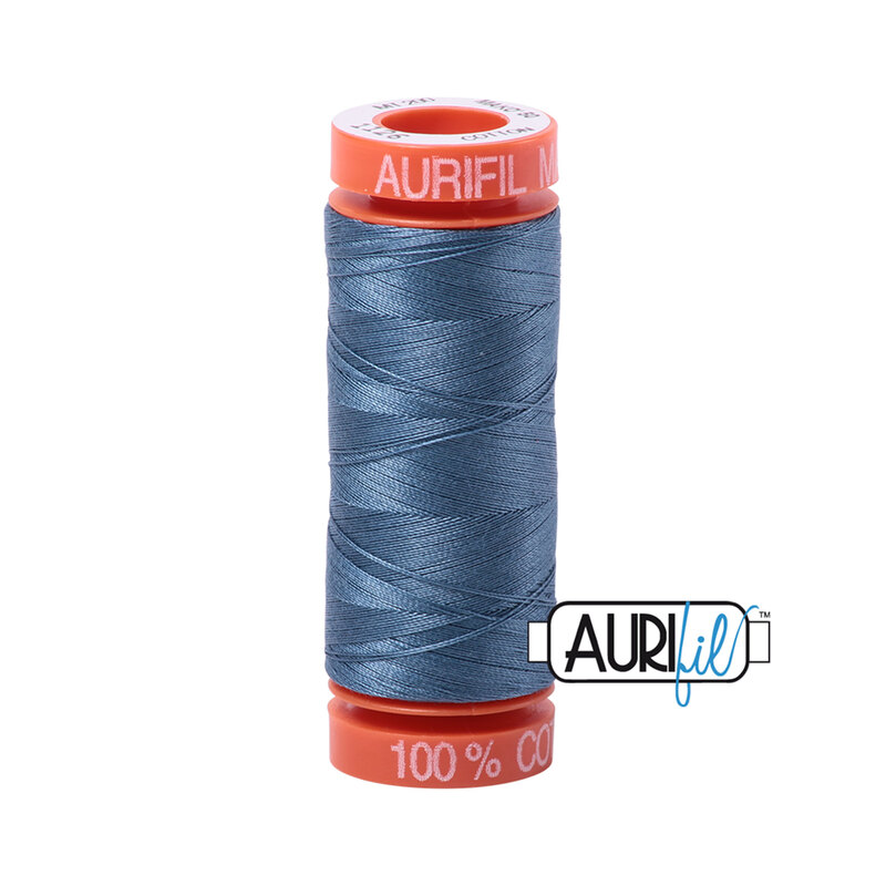 Blue gray thread on an orange spool, isolated on a white background