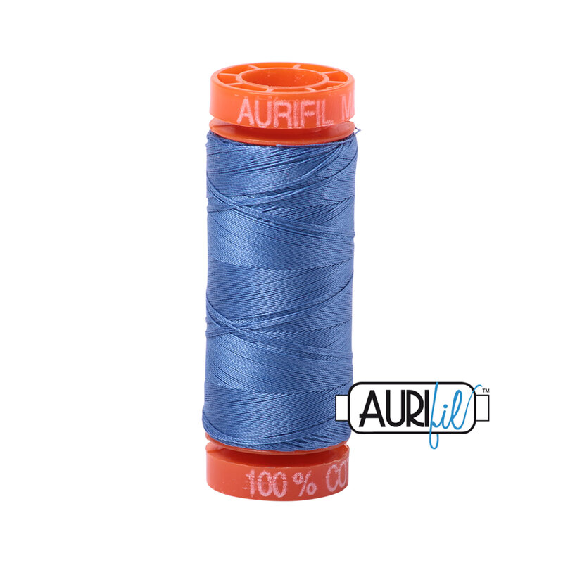 Light Blue Violet thread on an orange spool, isolated on a white background