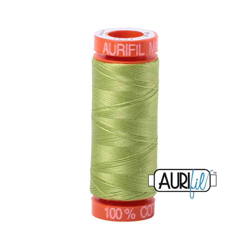 Spring Green thread on an orange spool, isolated on a white background