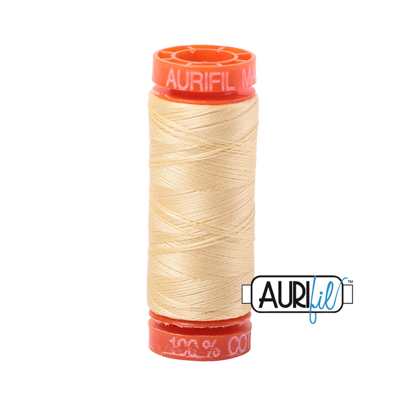 Champagne thread on an orange spool, isolated on a white background