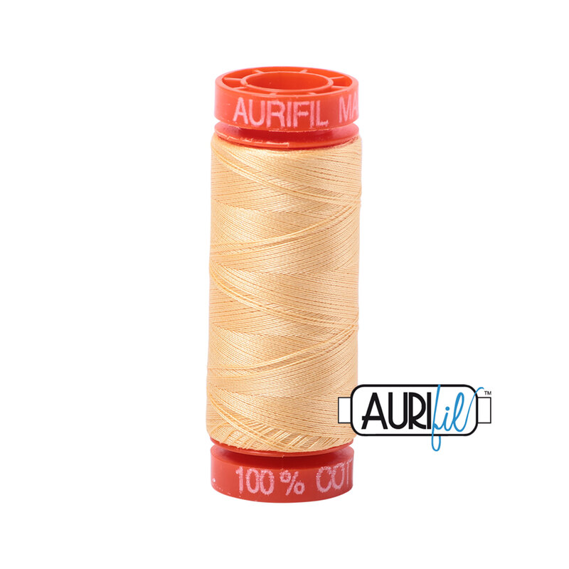 Medium Butter thread on an orange spool, isolated on a white background