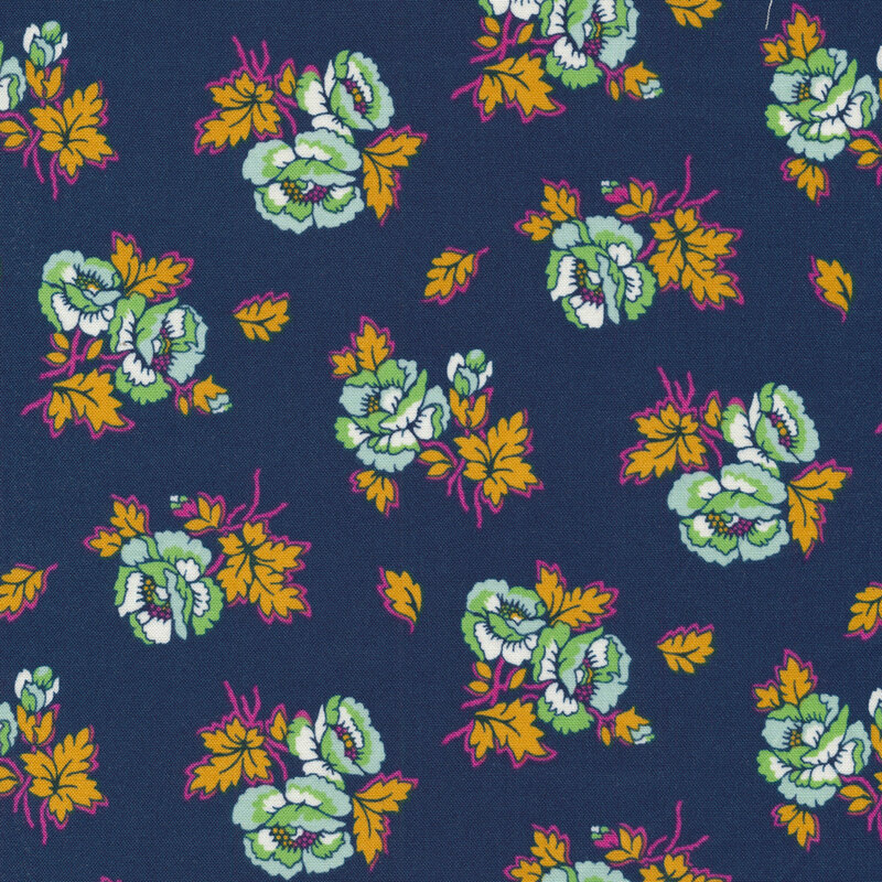navy blue fabric featuring scattered green flowers with yellow ochre leaves and magenta accenting