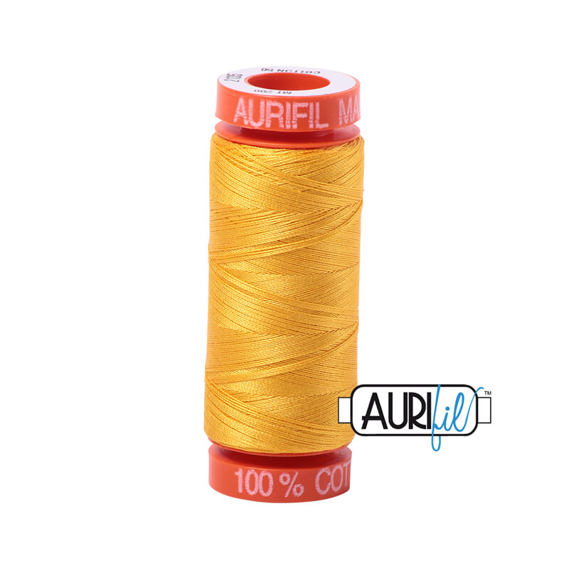 Yellow thread on an orange spool, isolated on a white background