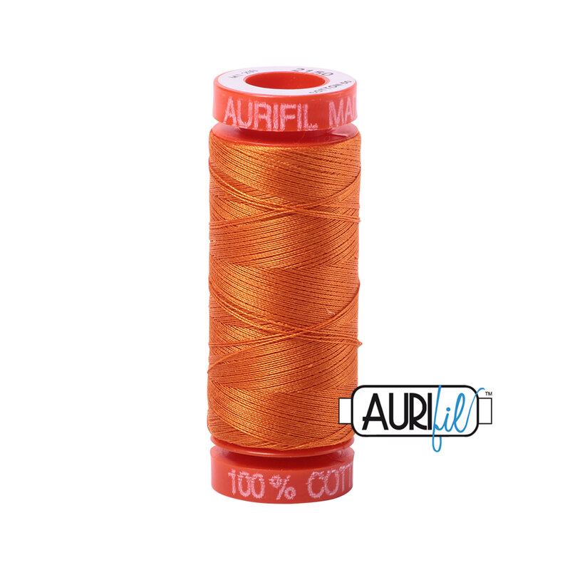 Pumpkin thread on an orange spool, isolated on a white background