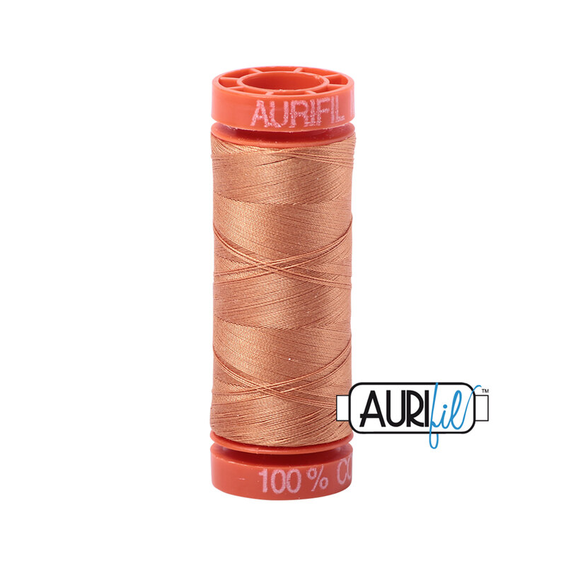 Caramel thread on an orange spool, isolated on a white background