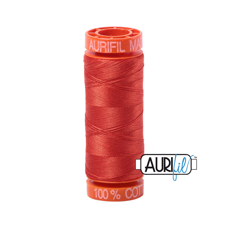 Red Orange thread on an orange spool, isolated on a white background
