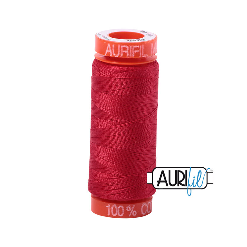 Red thread on an orange spool, isolated on a white background