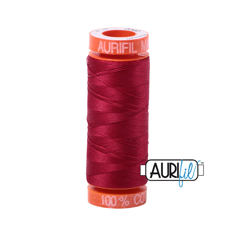 Red Wine thread on an orange spool, isolated on a white background