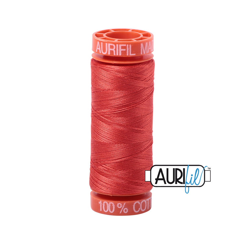 Light Red Orange thread on an orange spool, isolated on a white background