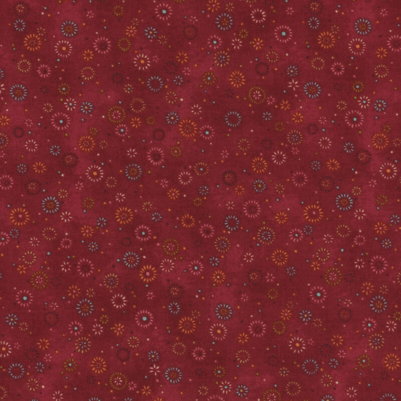 Red mottled fabric with little color bursts.