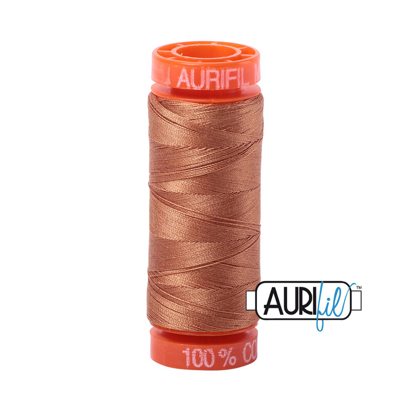 Light Chestnut thread on an orange spool, isolated on a white background