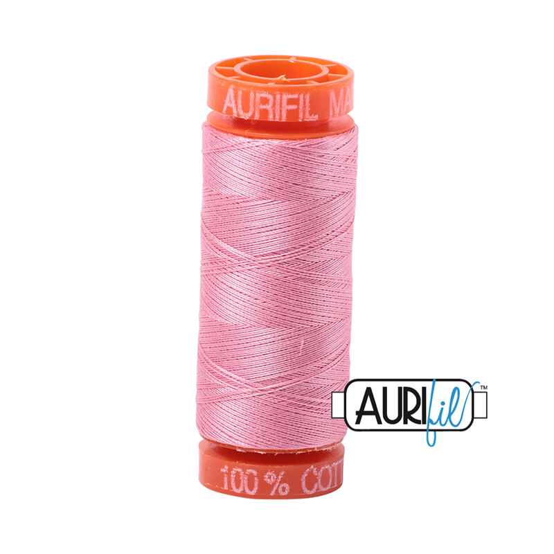 Bright Pink thread on an orange spool, isolated on a white background
