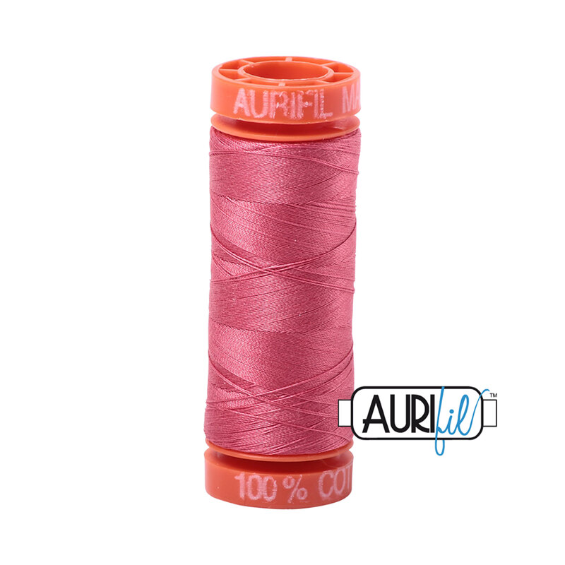 Peony thread on an orange spool, isolated on a white background