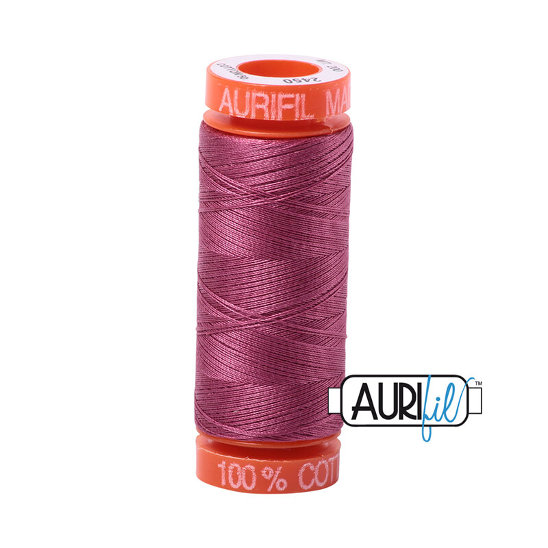 Rose thread on an orange spool, isolated on a white background
