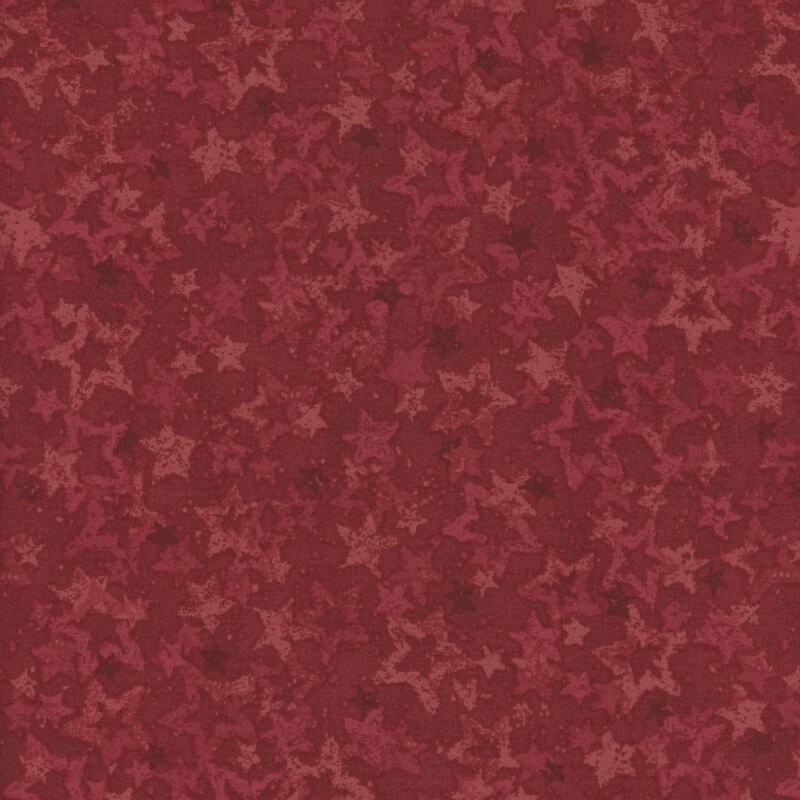 Red fabric with various tonal red stars.