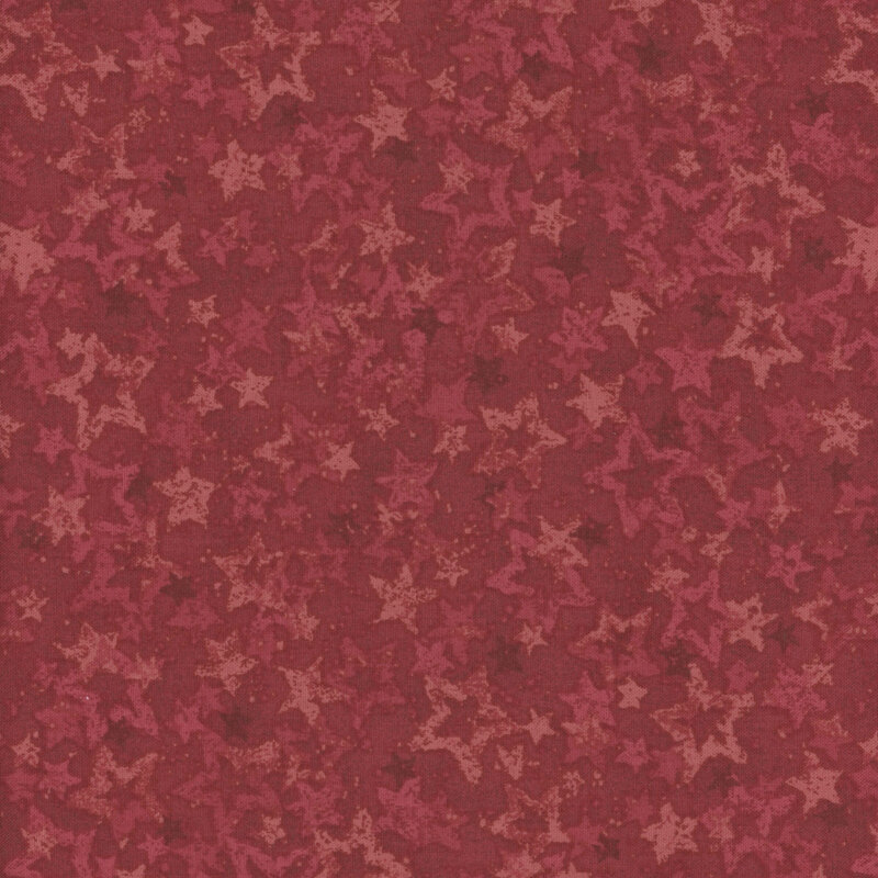 Red fabric with various tonal red stars.