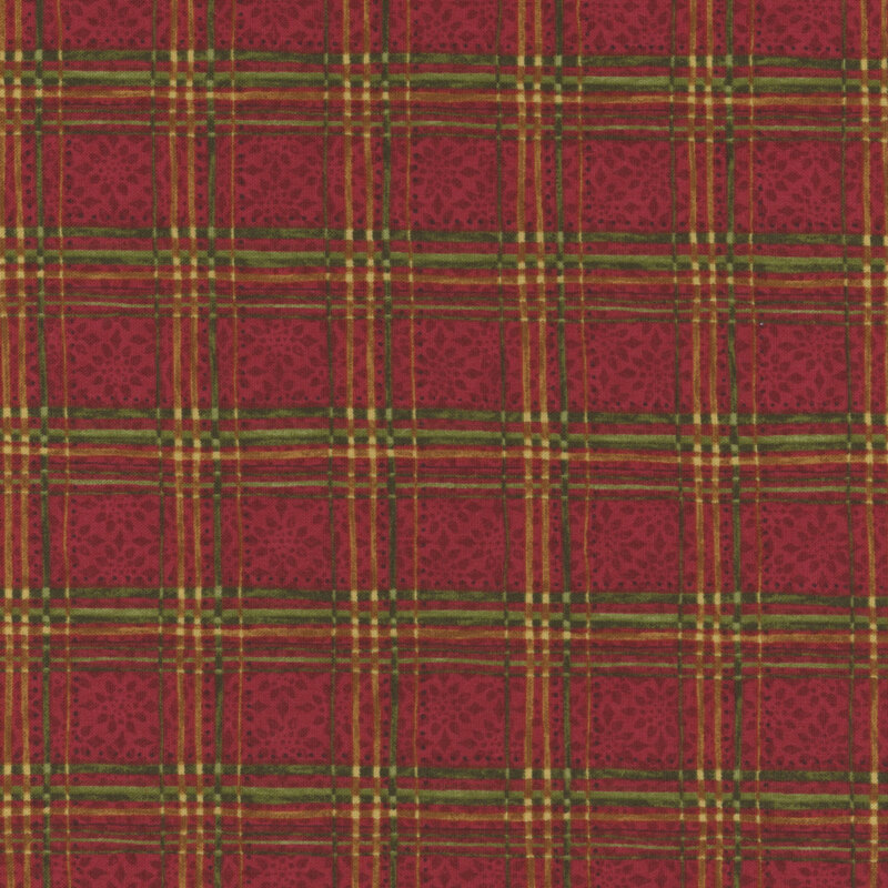 Green and gold plaid on a red background with a snowflake pattern.
