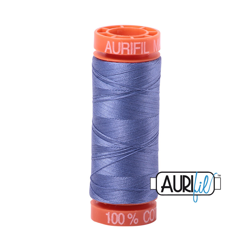Dusty Blue Violet thread on an orange spool, isolated on a white background