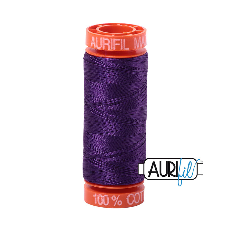 Medium Purple thread on an orange spool, isolated on a white background