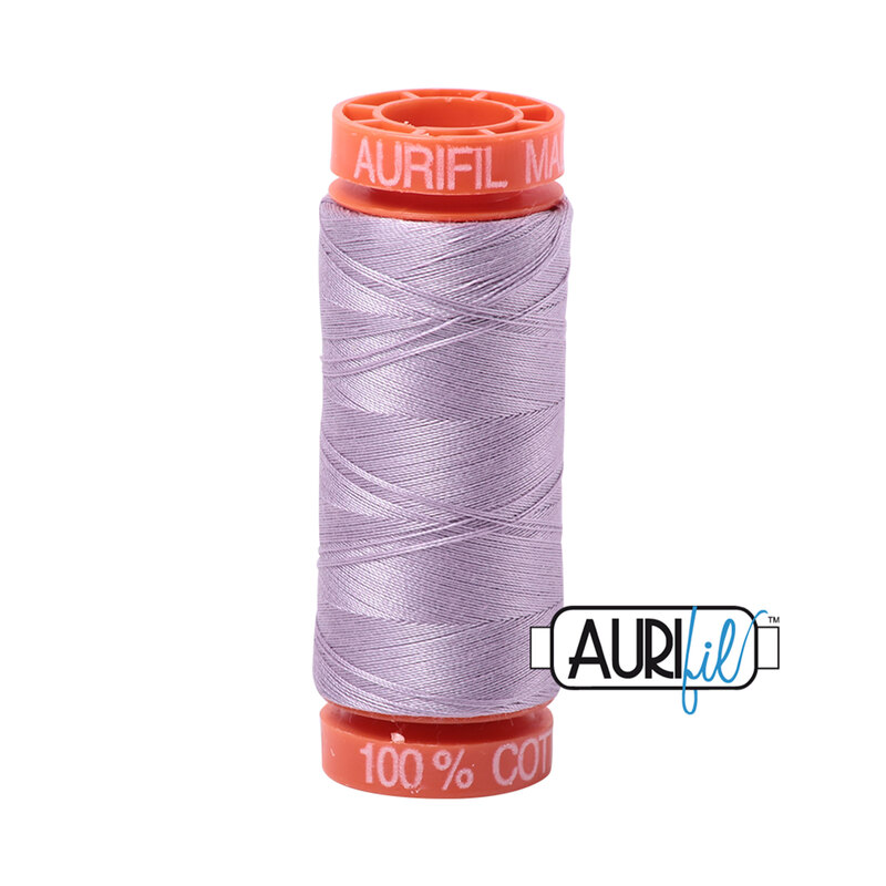 Lilac thread on an orange spool, isolated on a white background
