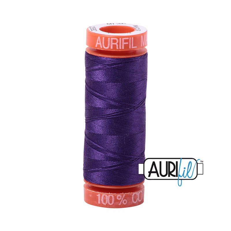 Dark Violet thread on an orange spool, isolated on a white background