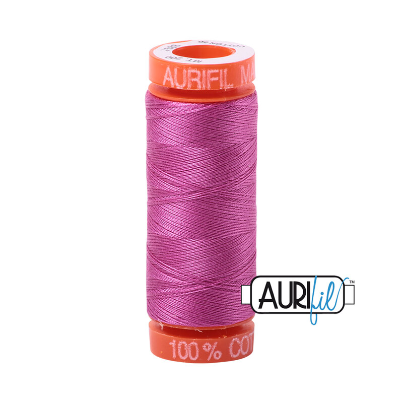 Light Magenta thread on an orange spool, isolated on a white background
