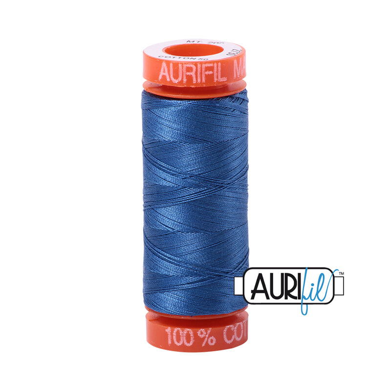 Delft Blue thread on an orange spool, isolated on a white background