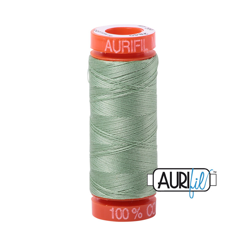 Loden Green thread on an orange spool, isolated on a white background