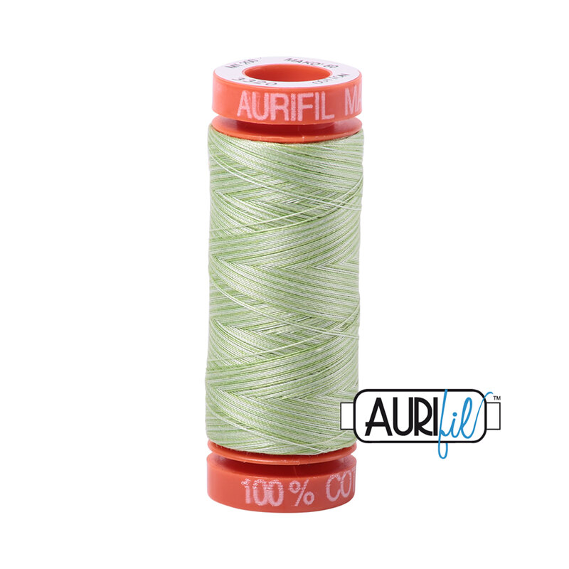 Light Spring Green thread on an orange spool, isolated on a white background