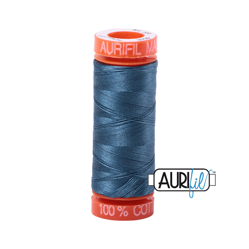 Smoke Blue thread on an orange spool, isolated on a white background