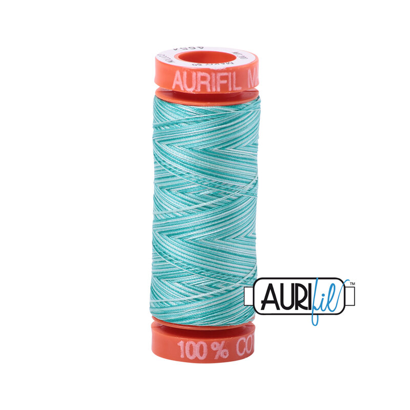 Turquoise Foam thread on an orange spool, isolated on a white background