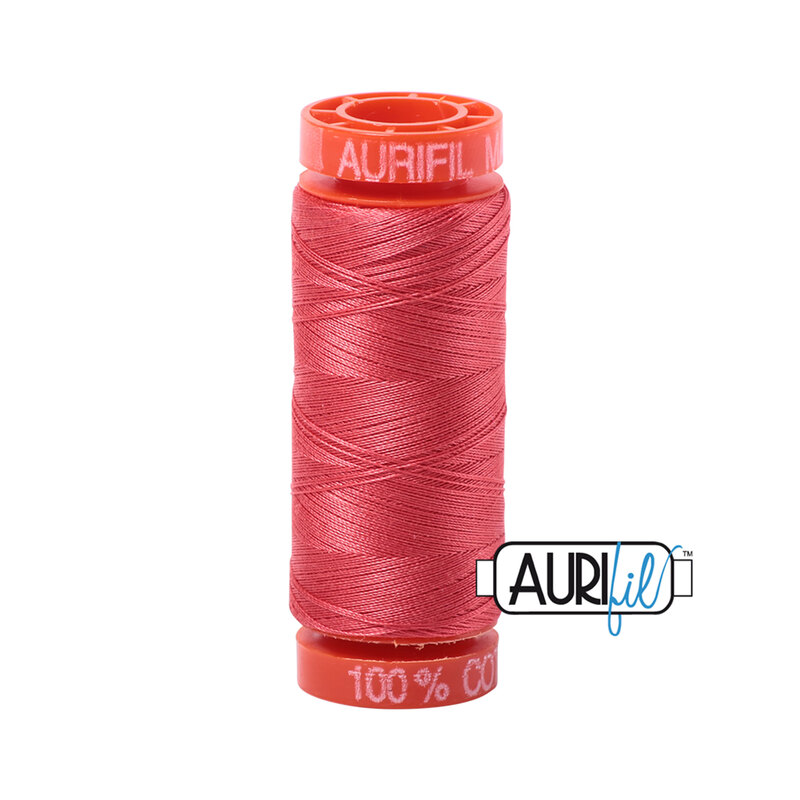 Medium Red thread on an orange spool, isolated on a white background