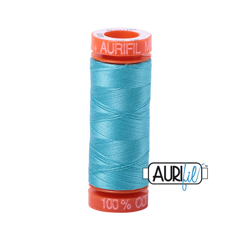 Bright Turquoise thread on an orange spool, isolated on a white background