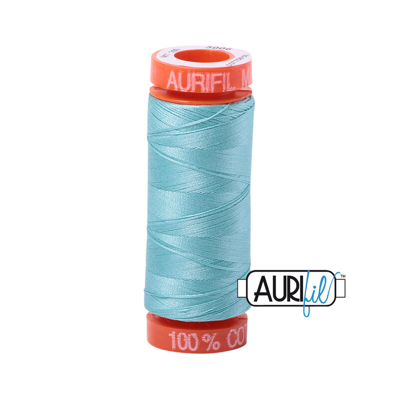 Light Turquoise thread on an orange spool, isolated on a white background