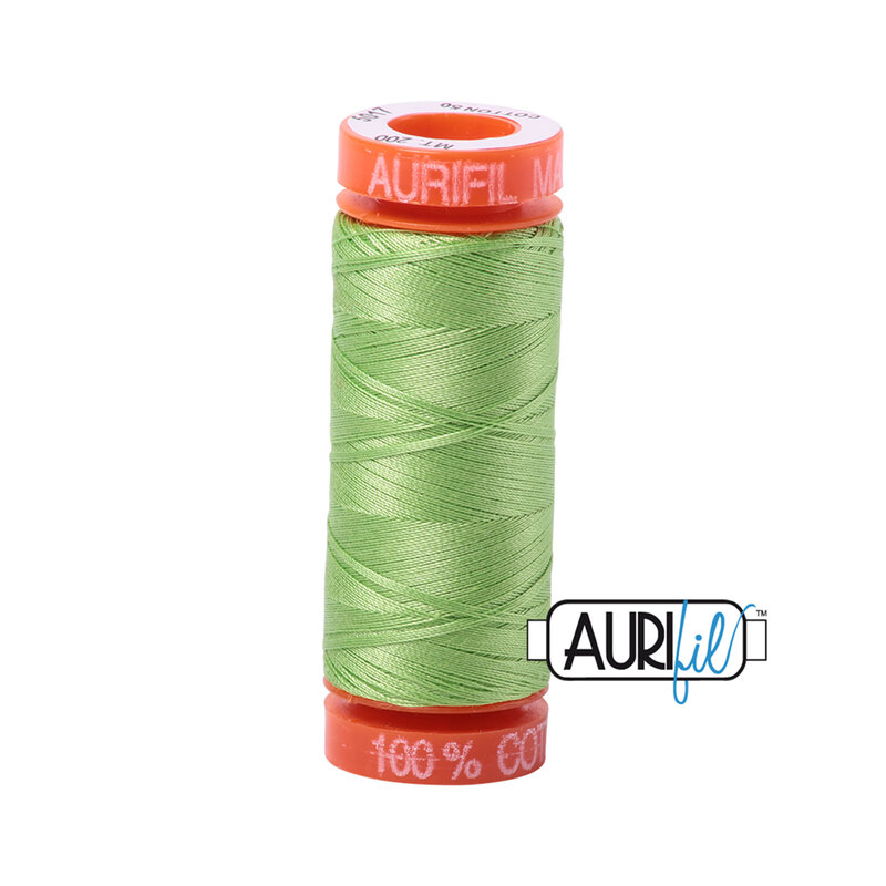 Shining Green thread on an orange spool, isolated on a white background