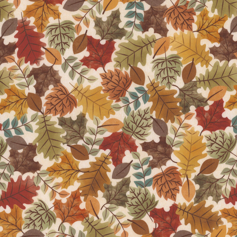 fabric featuring colored leaves on a cream background