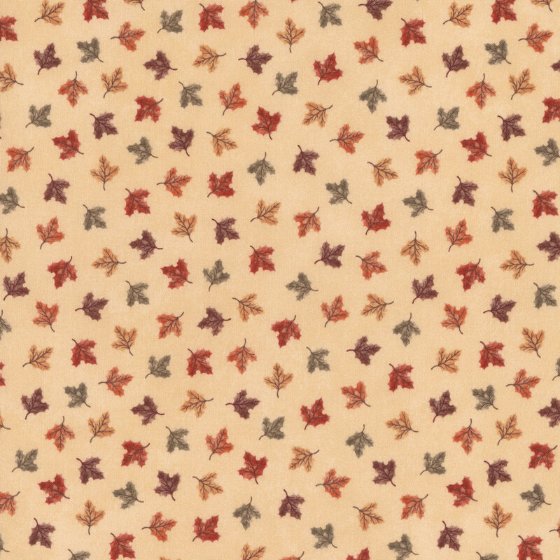 cream fabric tossed with colored leaves 