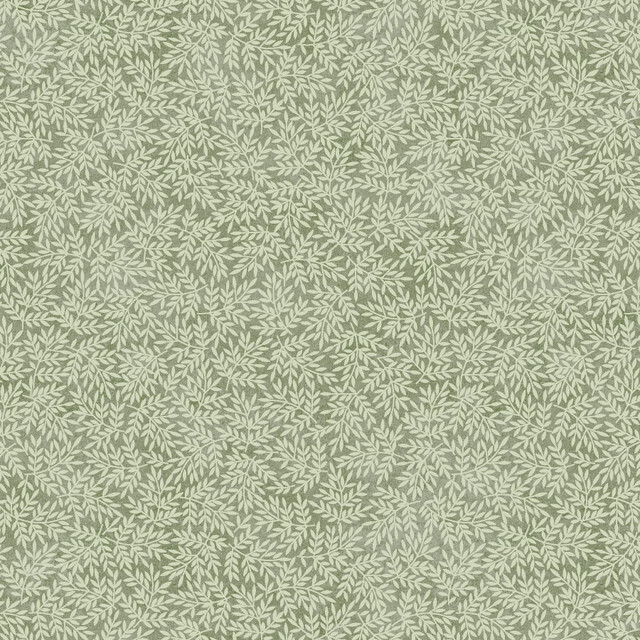 fabric featuring leaves on a green background
