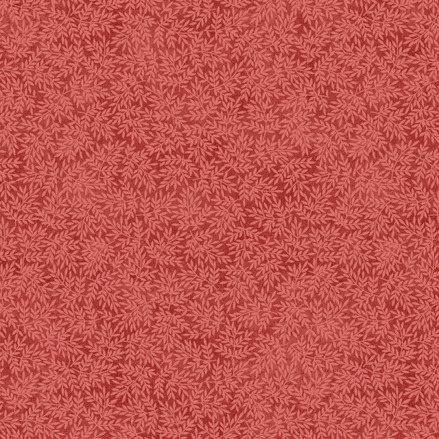 fabric featuring leaves on a red background