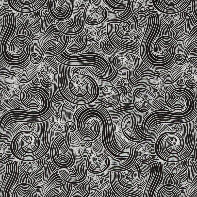 Scan of fabric with a white swirling motif on a black fabric