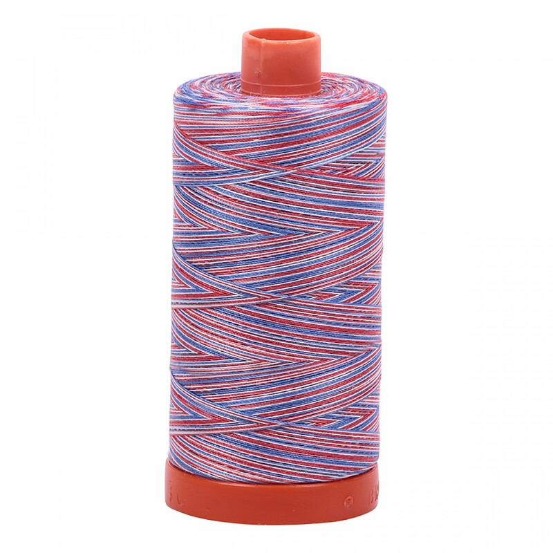 A spool of Aurifil 3852 - Liberty thread on a white background