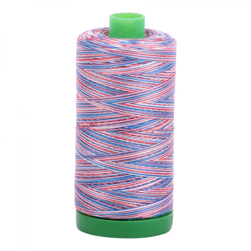 A spool of Aurifil 3852 40 wt - Liberty thread on a white background